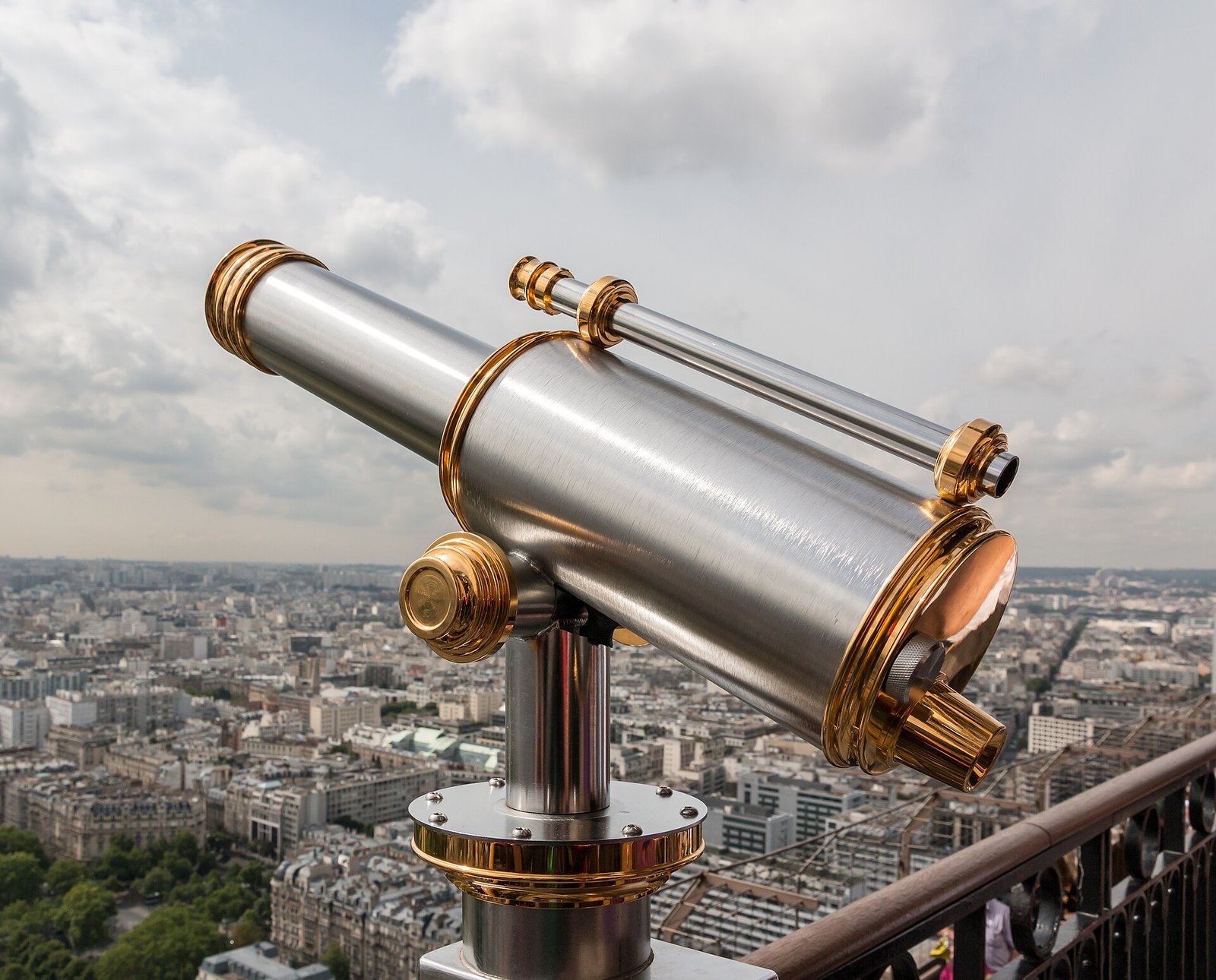 Telescope on the observation deck of the Eiffel Tower, Paris, FranceThe Eiffel Tower is the most famous landmark in Paris. It was built f…
